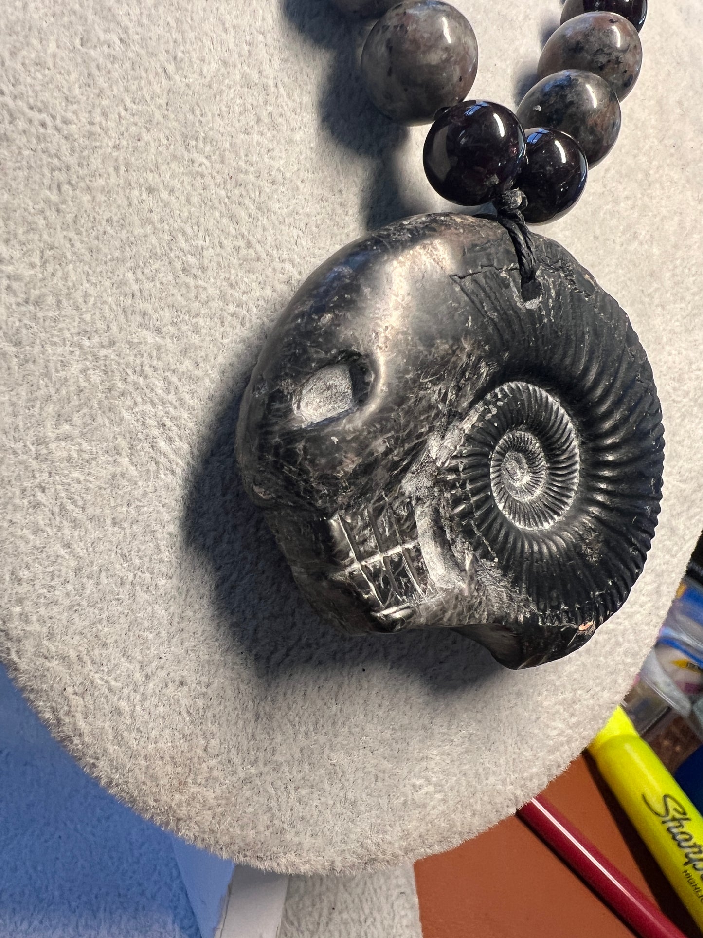 Alien Skull Carved in Ammonite, Necklace translucent garnet spheres yoperlite spheres (#35)