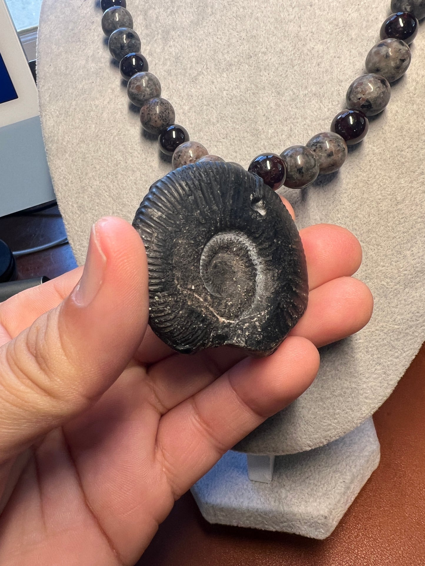 Alien Skull Carved in Ammonite, Necklace translucent garnet spheres yoperlite spheres (#35)