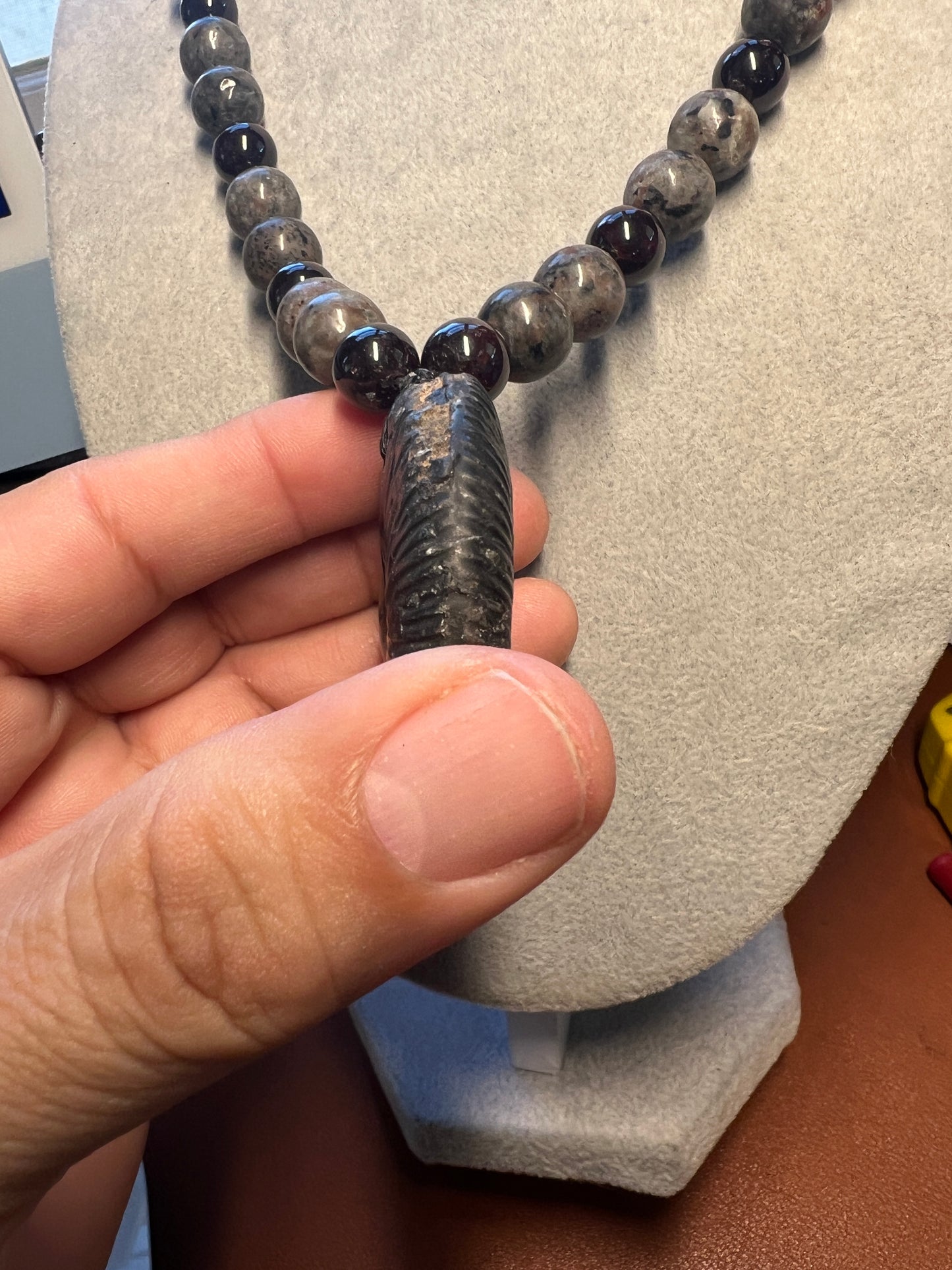 Alien Skull Carved in Ammonite, Necklace translucent garnet spheres yoperlite spheres (#35)