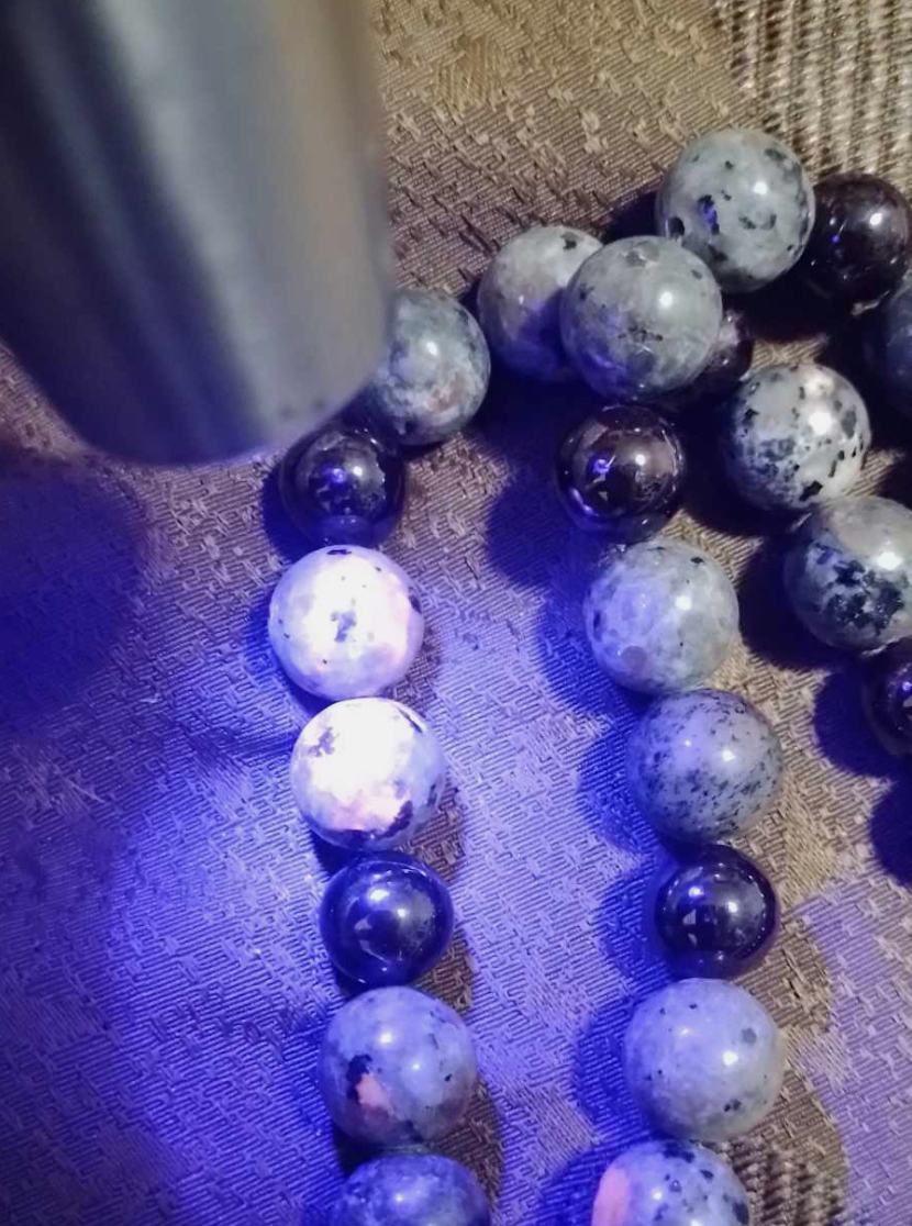 Alien Skull Carved in Ammonite, Necklace translucent garnet spheres yoperlite spheres (#35)