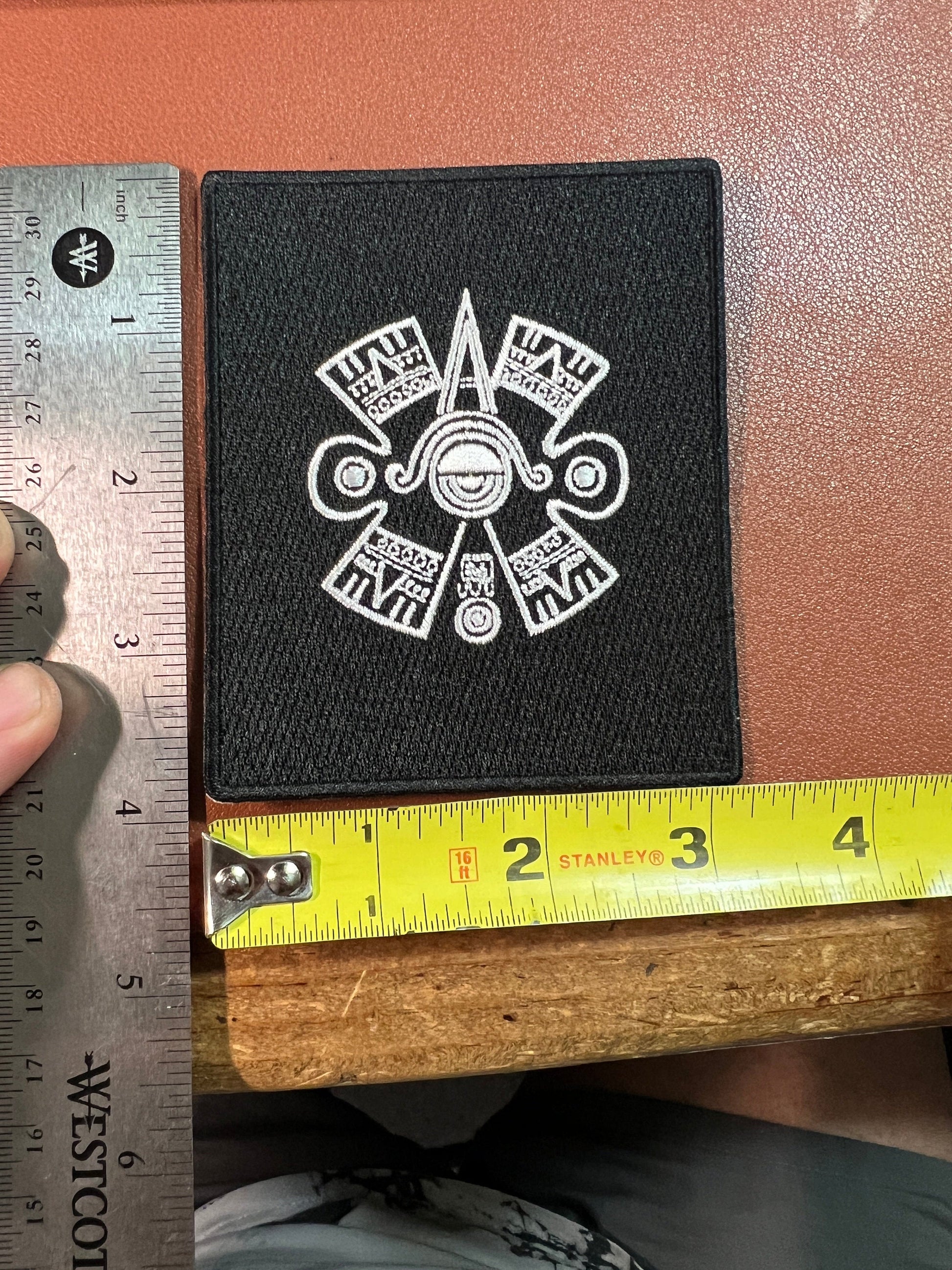 Nahui Olin Patch, Aztec Movement Sign, Iron On, Black and Silver 4" x 3 1/4", (#13)